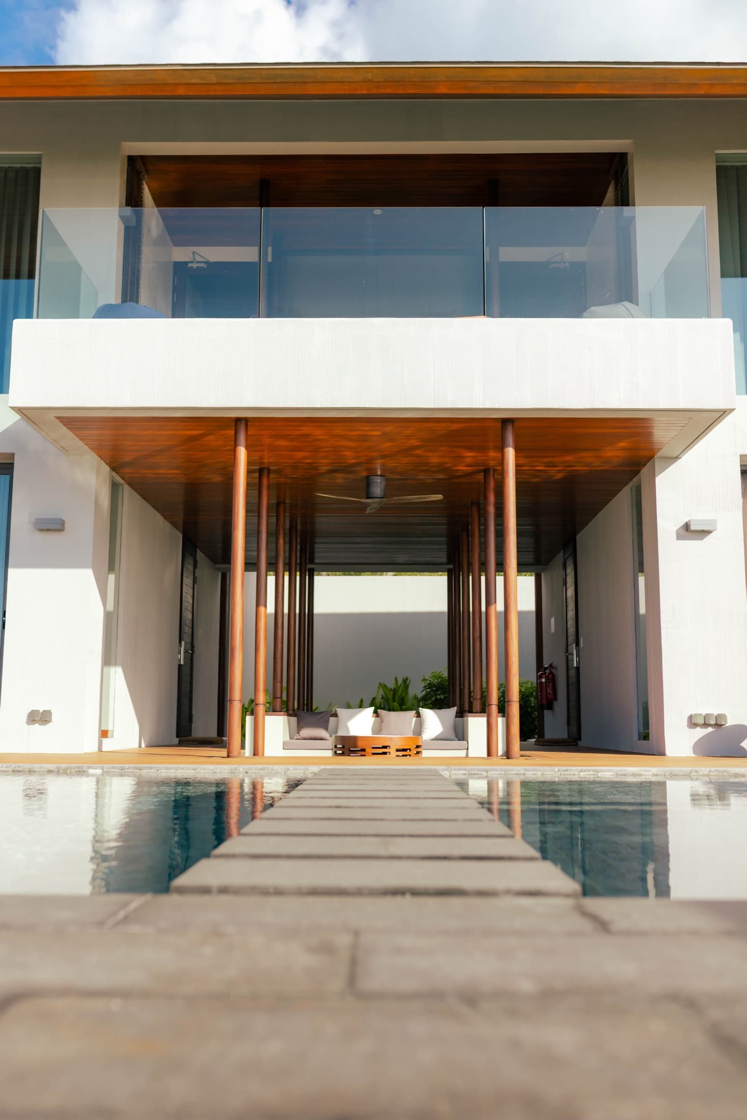 A two-storey villa opening onto its private pool