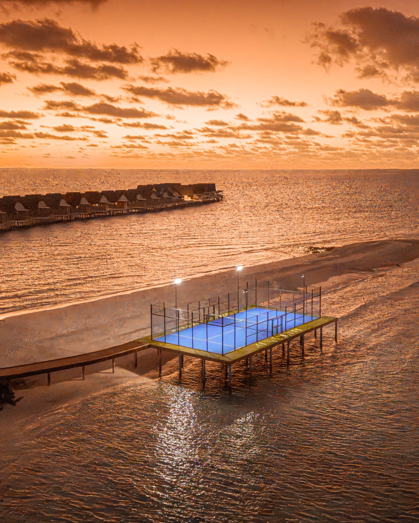 An overwater padel tennis court seen from the air